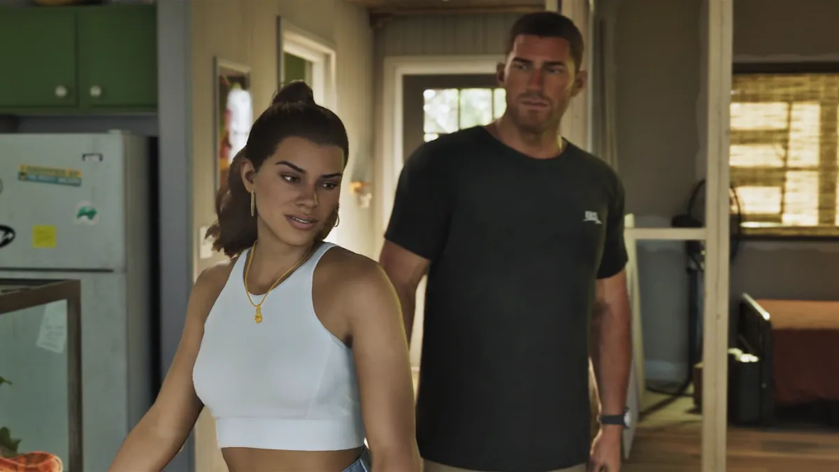 GTA 6 characters Jason and Lucia standing together inside a house in a close-up scene from Trailer 2