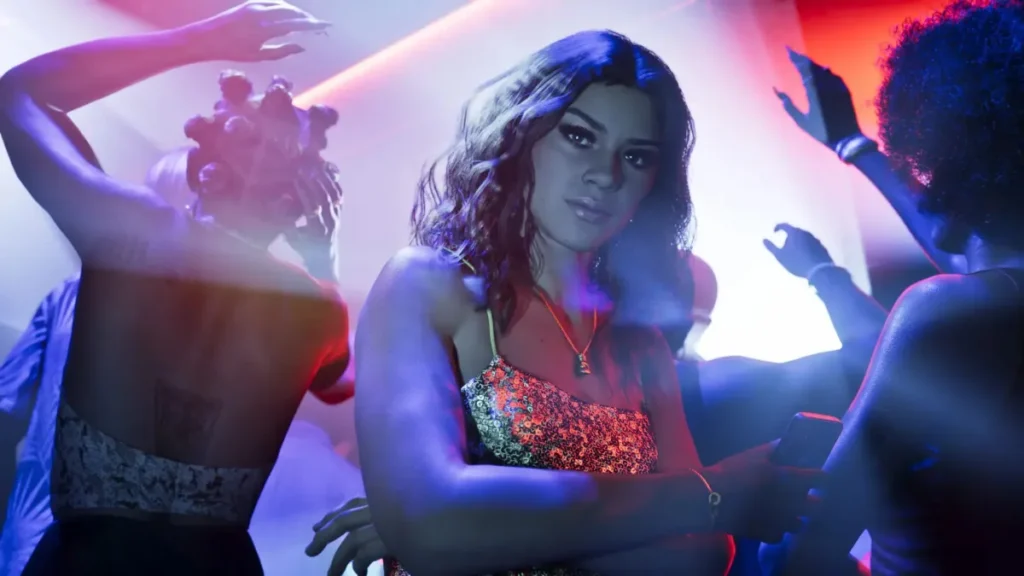 Lucia Caminos Lucia in nightclub surrounded by dancers and neon lights in GTA 6